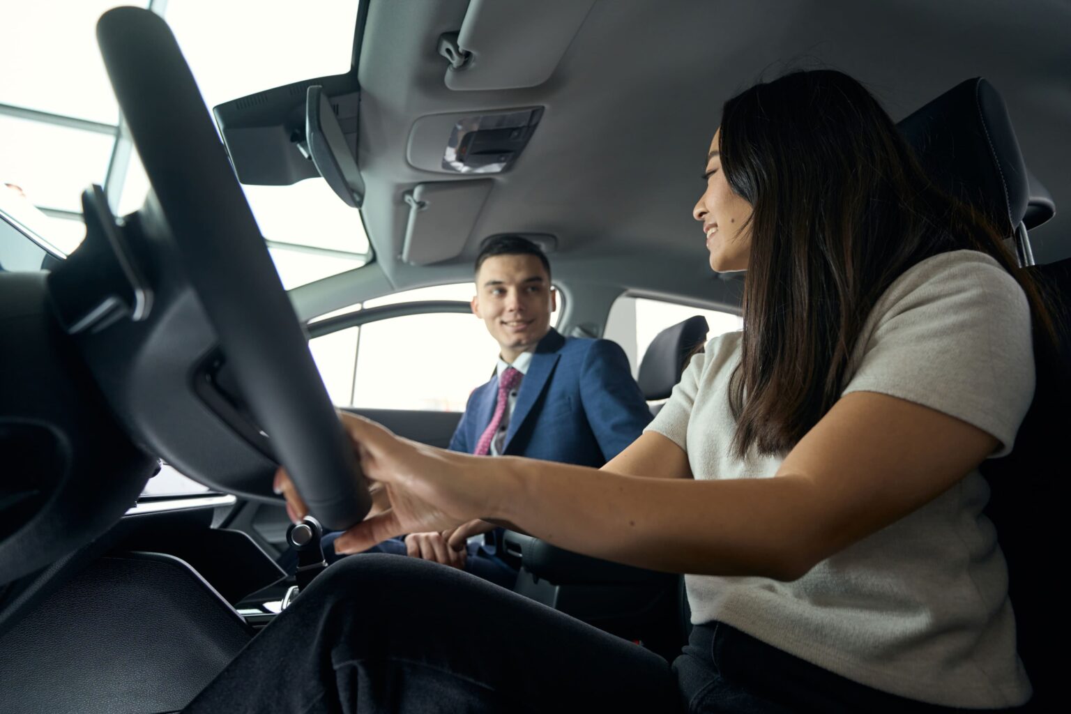brunette-woman-driving-a-car-communicates-with-you-2024-10-21-22-57-45-utc