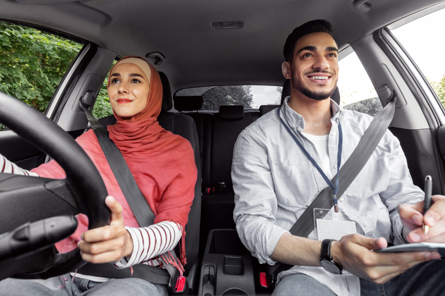 smiling-millennial-arab-woman-in-hijab-taking-driv-2025-03-18-18-47-28-utc
